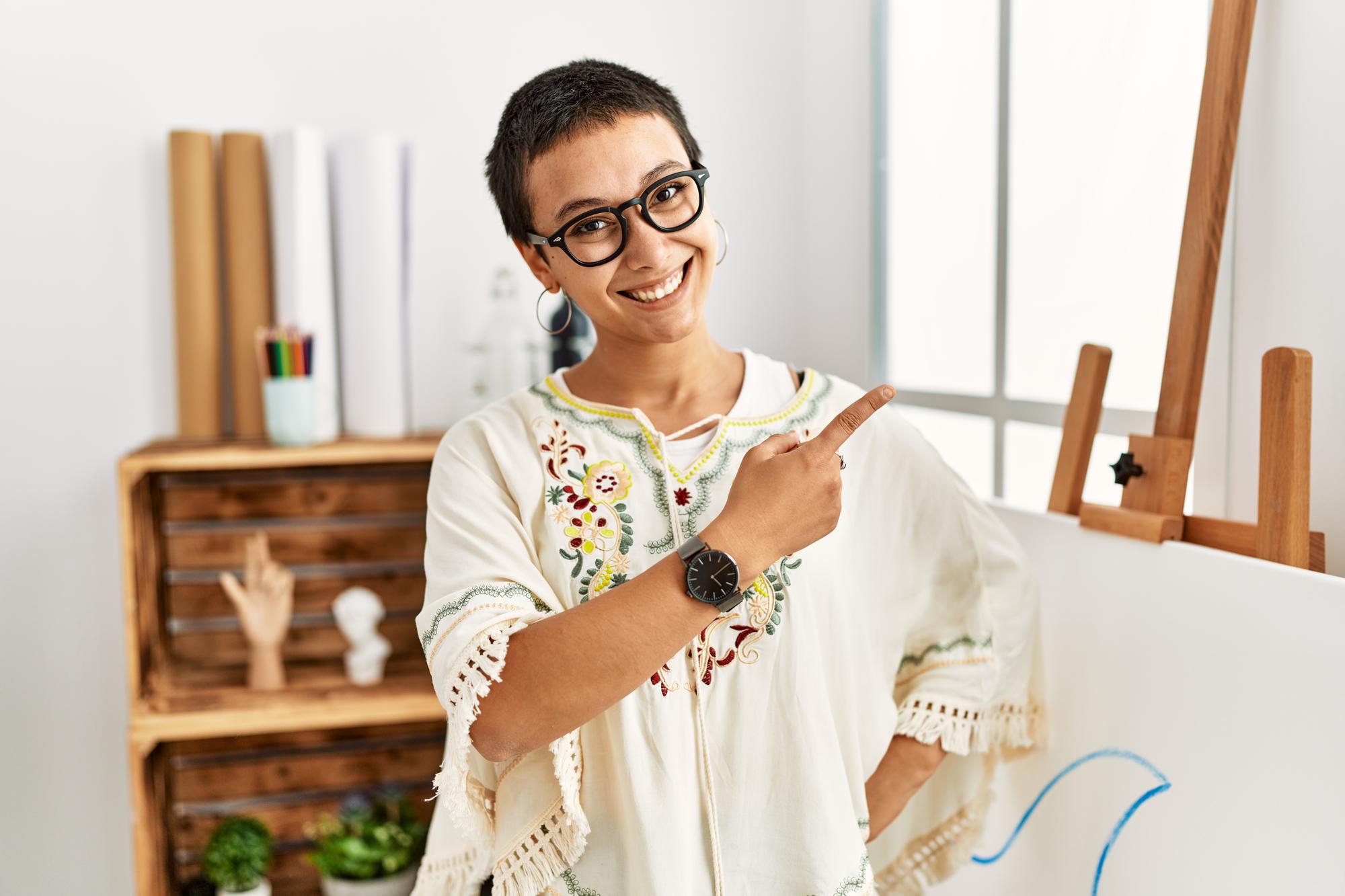 Instructor showing embroidered sample during workshop
